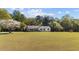 Ranch style home with nice deck, landscaping and black shutters at 413 Bayles Rd, Lillington, NC 27546