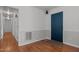 Hallway with wood laminate flooring and access to rooms at 413 Bayles Rd, Lillington, NC 27546