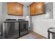 Convenient laundry room with modern appliances and storage cabinets at 413 Bayles Rd, Lillington, NC 27546