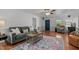 Comfortable living room with wood laminate flooring and a contemporary area rug at 413 Bayles Rd, Lillington, NC 27546