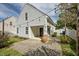 A view of the home's back exterior featuring an outdoor patio and back entrance at 4414 Nightfall Ct, Durham, NC 27713