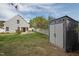 Backyard with a storage shed, patio, and a well-manicured lawn at 4414 Nightfall Ct, Durham, NC 27713
