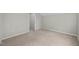 Neutral bedroom with carpet, base molding and a door leading to another room at 4414 Nightfall Ct, Durham, NC 27713