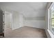 Neutral bedroom showing multiple doorways leading to other rooms at 4414 Nightfall Ct, Durham, NC 27713