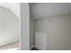 Small unfinished closet with access panel and wire shelf at 4414 Nightfall Ct, Durham, NC 27713