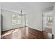 Bright dining area with hardwood floors, chandelier, and natural light at 4414 Nightfall Ct, Durham, NC 27713