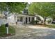 Charming home featuring a covered porch, black shutters and a well-maintained landscaped yard at 4414 Nightfall Ct, Durham, NC 27713