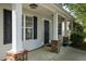 Close-up of the front porch with classic columns and a stylish front door, creating an appealing entryway at 4414 Nightfall Ct, Durham, NC 27713