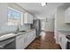 Bright kitchen with stainless steel appliances, granite countertops and a subway tile backsplash at 4414 Nightfall Ct, Durham, NC 27713