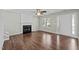Living room featuring a fireplace, hardwood floors and access to the back patio at 4414 Nightfall Ct, Durham, NC 27713