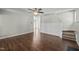 Spacious living room with hardwood floors and staircase leading upstairs at 4414 Nightfall Ct, Durham, NC 27713