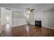 Spacious living room with hardwood floors, fireplace and a ceiling fan at 4414 Nightfall Ct, Durham, NC 27713