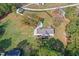 Expansive green lawn and manicured landscaping enhance this home's curb appeal in this aerial view at 460 Mann Rd, Coats, NC 27521