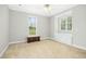Spacious bedroom with neutral carpet, two windows, and built-in storage at 460 Mann Rd, Coats, NC 27521