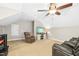 Bonus room with recliner, TV, and fan at 460 Mann Rd, Coats, NC 27521