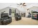 Bonus room with recliner, exercise equipment, and ceiling fan at 460 Mann Rd, Coats, NC 27521