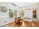 Bright breakfast nook with large windows and views of the outdoors at 460 Mann Rd, Coats, NC 27521