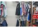 Organized closet with hanging clothes and shelves at 460 Mann Rd, Coats, NC 27521