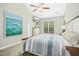 Bedroom featuring vaulted ceilings, a ceiling fan, and a large window at 460 Mann Rd, Coats, NC 27521
