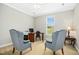 Home office space with desk, chairs, and natural light from the window at 460 Mann Rd, Coats, NC 27521