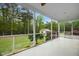 Screened porch with views of the private back yard at 460 Mann Rd, Coats, NC 27521