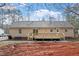 The backyard has a wooden deck and slider door into the home at 4720 Brigadoon Dr, Durham, NC 27705