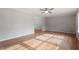 Open-concept living area featuring hardwood floors and neutral paint, offering a bright and airy feel at 4720 Brigadoon Dr, Durham, NC 27705