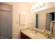 Bathroom featuring a vanity, storage, and bright lighting at 502 W Poplar Ave # C2, Carrboro, NC 27510