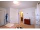 Bedroom featuring carpet floors and access to the ensuite bathroom at 502 W Poplar Ave # C2, Carrboro, NC 27510