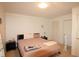 Cozy bedroom features neutral walls and furnishings and closet at 502 W Poplar Ave # C2, Carrboro, NC 27510