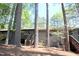 Exterior view of home's decks surrounded by lush trees at 502 W Poplar Ave # C2, Carrboro, NC 27510
