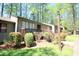 Attractive condo featuring well-maintained landscaping and a wooden porch at 502 W Poplar Ave # C2, Carrboro, NC 27510