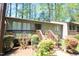 Charming townhouse featuring a cozy porch and mature landscaping at 502 W Poplar Ave # C2, Carrboro, NC 27510