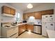 Functional kitchen with appliances and ample cabinet space at 502 W Poplar Ave # C2, Carrboro, NC 27510