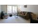 Comfortable living room with large window providing ample natural light at 502 W Poplar Ave # C2, Carrboro, NC 27510