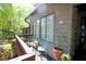 Relaxing porch with seating overlooking lush greenery and neighborhood views at 502 W Poplar Ave # C2, Carrboro, NC 27510