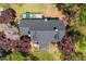 Aerial view of a home with a deck, nice roof, and landscaped surroundings at 5212 Theys Rd, Raleigh, NC 27606