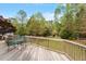 Inviting back deck area with outdoor seating, perfect for enjoying the serene backyard views at 5212 Theys Rd, Raleigh, NC 27606