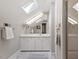 Bright and airy bathroom with skylights, white cabinetry, and a walk-in shower at 5212 Theys Rd, Raleigh, NC 27606