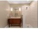 Updated bathroom with granite countertop vanity and a tiled walk-in shower at 5212 Theys Rd, Raleigh, NC 27606