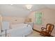 Cozy bedroom featuring soft, natural light and neutral decor at 5212 Theys Rd, Raleigh, NC 27606