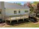 Home exterior and large wooden deck with stairs to backyard at 5212 Theys Rd, Raleigh, NC 27606