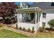 Charming front porch with rocking chairs, offering a relaxing outdoor space at 5212 Theys Rd, Raleigh, NC 27606