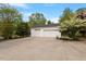 Spacious three-car garage with a wide driveway, offering ample parking and storage at 5212 Theys Rd, Raleigh, NC 27606
