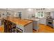 Spacious kitchen with island seating, stainless steel appliances, and ample storage at 5212 Theys Rd, Raleigh, NC 27606