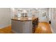 Gourmet kitchen with a large island, butcher block countertop, and modern appliances at 5212 Theys Rd, Raleigh, NC 27606