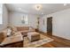 Comfortable living room with neutral colors, plush seating, and stylish accents at 5212 Theys Rd, Raleigh, NC 27606