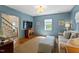 Blue Gathering room with a staircase view, providing a serene space at 5212 Theys Rd, Raleigh, NC 27606
