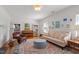 Inviting living room with a piano, cozy seating area, and classic decor at 5212 Theys Rd, Raleigh, NC 27606