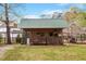 Backyard outbuilding with wood storage, perfect for a workshop or hobby space at 5212 Theys Rd, Raleigh, NC 27606